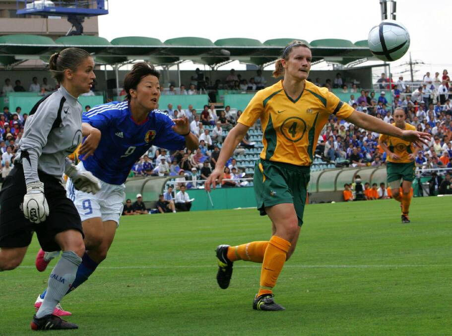 Japan's Yuki Nagasato, second from left, fights for the ball against Australia's goalkeeper Melissa Barbieri, left, and Dianne Alagich during a friendly match in Tokyo, 2005. (AP Photo/Katsumi Kasahara)