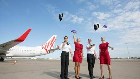 Virgin Australia staff celebrate the news of the company's sale to Bain Capital in 2020. Photo supplied
