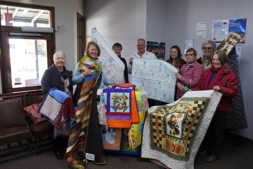 COLOURFUL: Quilters from Braidwood and surrounding regions celebrated close to 3000 hours of work for victims of the Carwoola bushfire and those at the Queanbeyan Women's Refuge. Photo: Mariam Koslay. 
