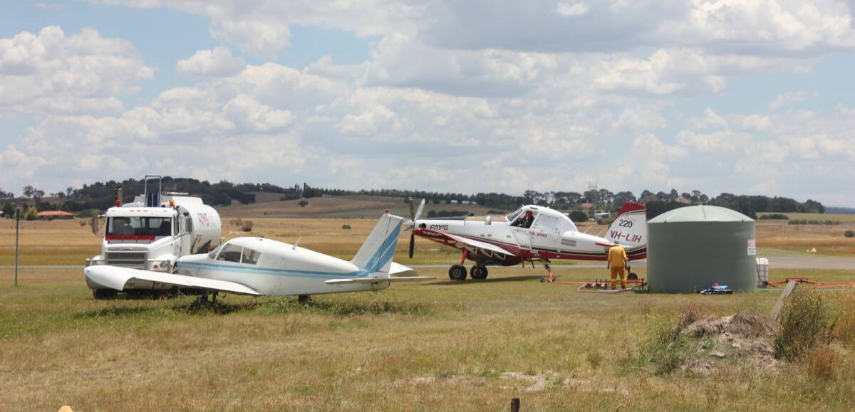 Fixed wing aircraft fill up with water at the Goulburn airport before tackling the Taylors Creek Road blaze.