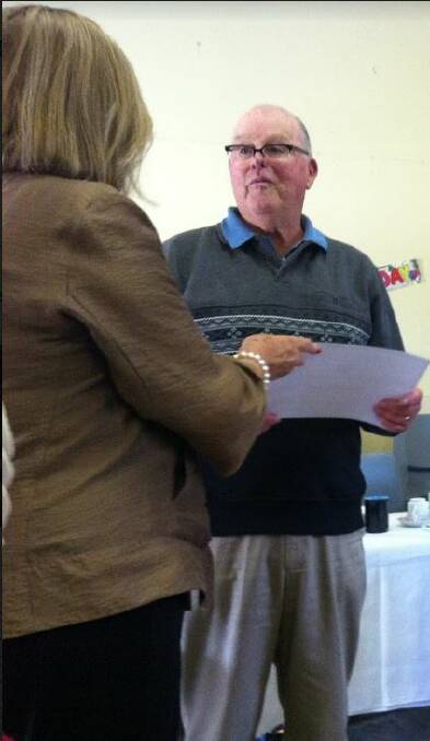 The certificate was presented to Brian by Pauline Dunk, group CWA president.