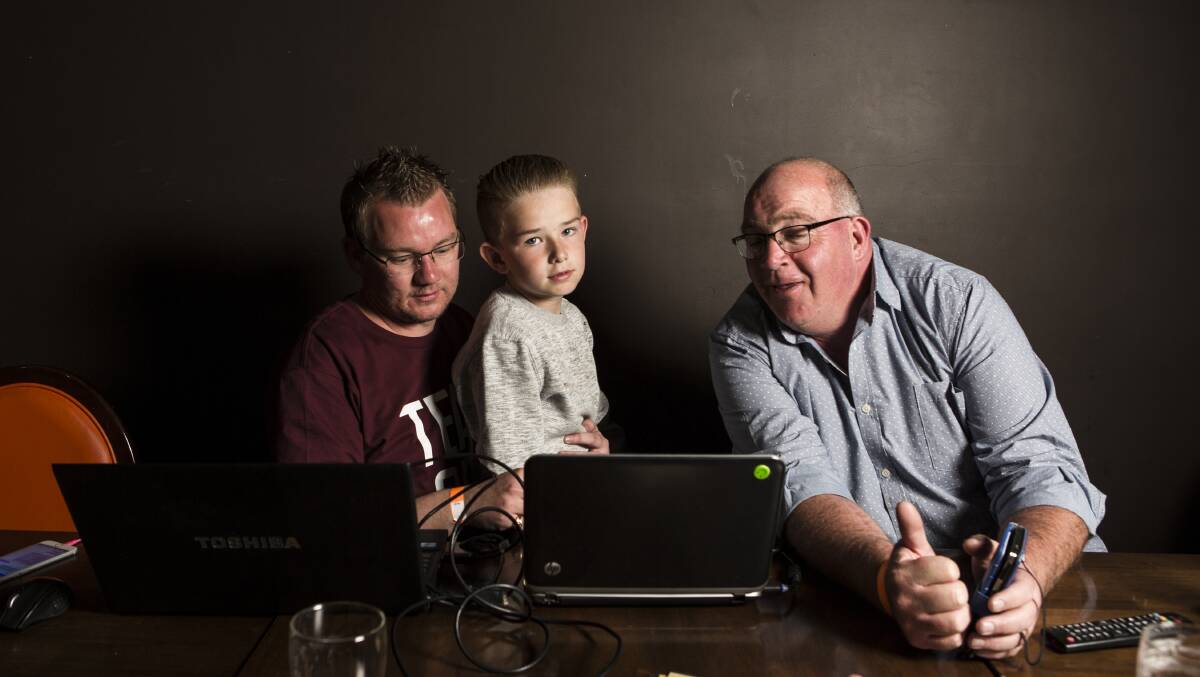 It looks likely Kenrick Winchester will secure his second stint on council. Here he watches the results come through on Saturday night with his nephew Riley Element ,10, and Tony Wood. Photo: Jamila Toderas