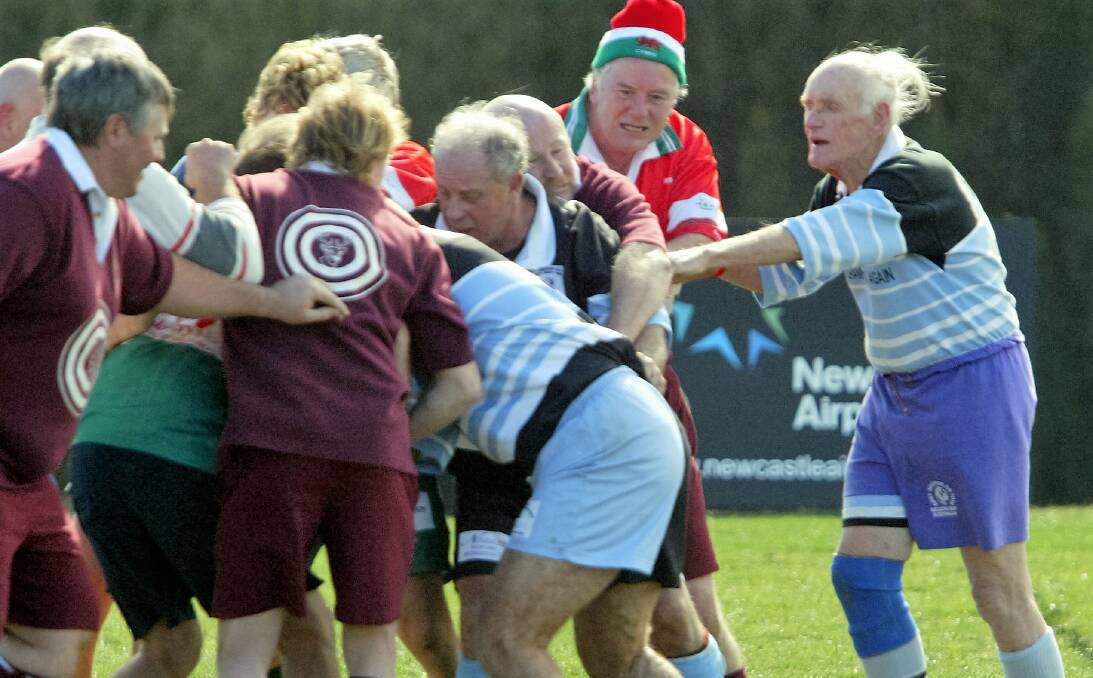 Golden Oldies Rugby Union: Bruce Moore, far right, 83, shows you're never too old to play the game they play in heaven. The Grande Olde Boares of Batemans Bay are recruiting over-35s now. Photo: Anita Jones