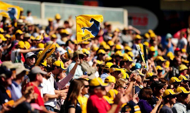 10 March 2012, photo by STUART WALMSLEY. Super Rugby round three. ACT Brumbies v Free State Cheetahs at Canberra Stadium. Brumbies fans fly the flag.
