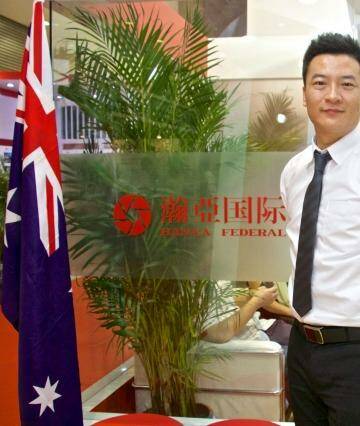 Money to be made in Australia: Wang Peng, of Hanya Federal at a property expo in Beijing. Photo: Sanghee Liu