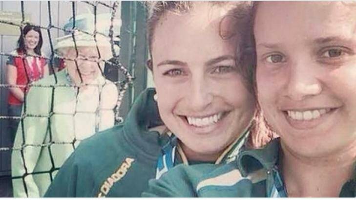 Royal blush: The Queen photobombs the Hockeyroos selfie. Photo: Twitter