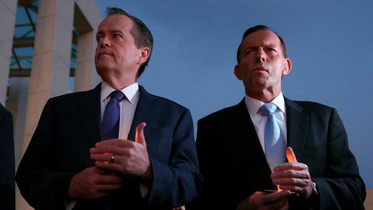 Opposition Leader Bill Shorten and Prime Minister Tony Abbott during a candlelight vigil for Andrew Chan and Myuran Sukumaran at Parliament House on Thursday.  Photo: Alex Ellinghausen