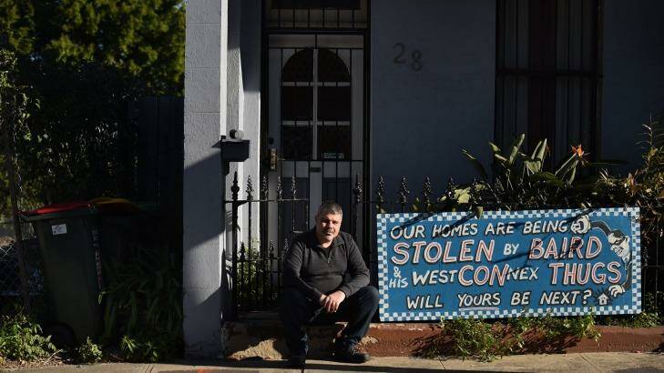 Disgruntled owner Richard Capuano with a protest sign outside his St Peters home. Photo: Kate Geraghty