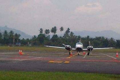 The Australian plane involved in an airspace dispute sits on the tarmac at Sam Ratulangi International Airport in Manado.