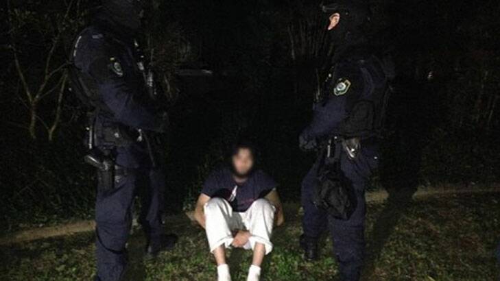 Police arrest a man in Thursday morning's raids. Source: NSW Police