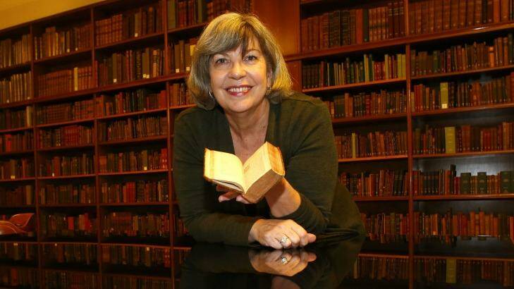 State Library of NSW's rare book expert, Maggie Patton, with the Bandello translation. Photo: Daniel Munoz