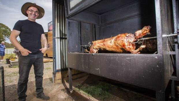 Robert Azbajic is attracting crowds of hungry travellers with his spit roast pig and lamb kebabs. Photo: Matt Bedford