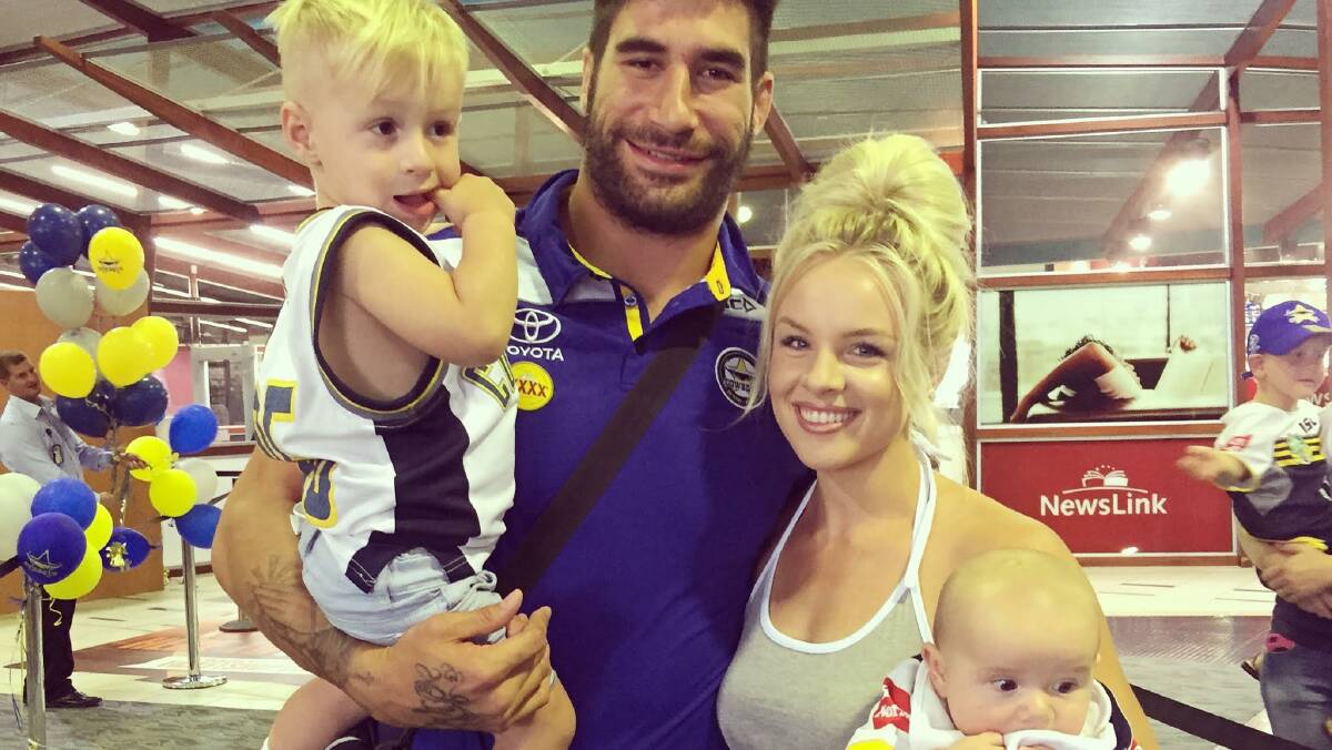 Local girl Brittney McGlone with her partner and North QLD Cowboys star, James Tamou, with their two sons, Brooklyn and Barclay.  