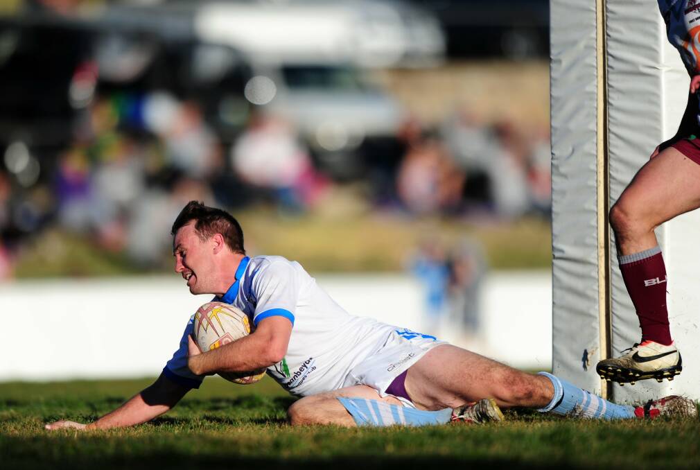 Queanbeyan Blues skipper Marc Herbert dives over for a try during his side's big 43-10 win over the Queanbeyan Kangaroos last Sunday. Photo: Melissa Adams.
