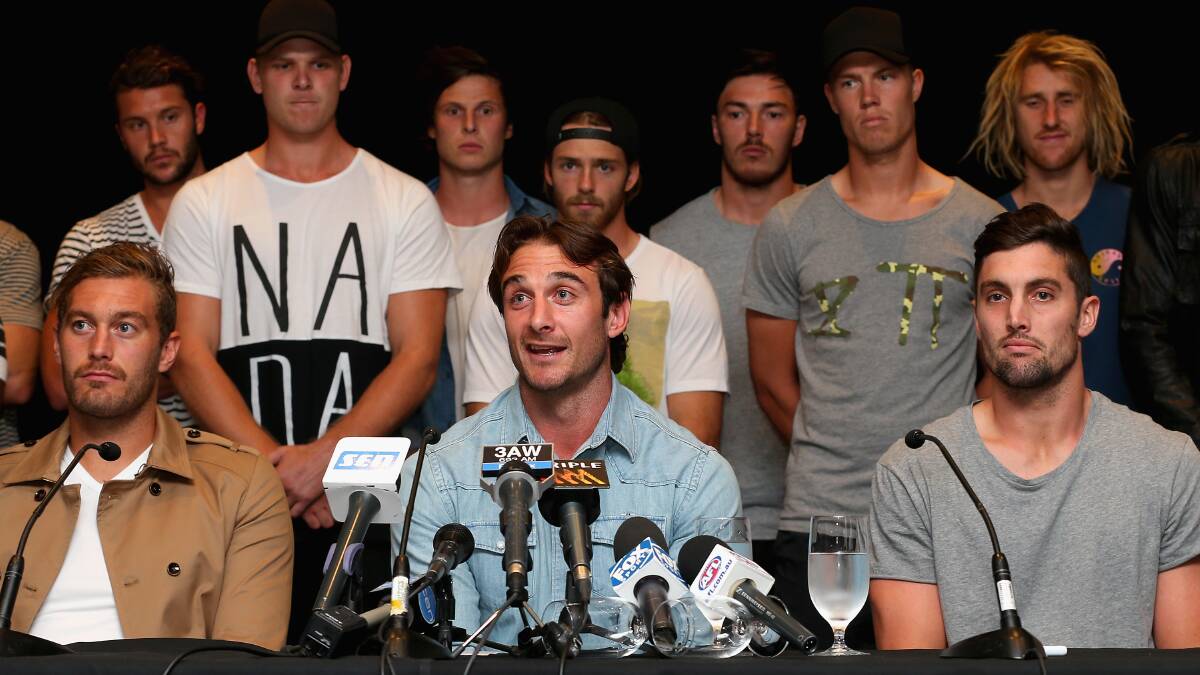 Jobe Watson the captain of the Bombers, flanked by his team mates talk aftrer the AFL's anti-doping tribunal announced that 34 past and present Essendon Bombers AFL players have been found not guilty of taking a banned substance. Pic: Quinn Roone, Getty Images