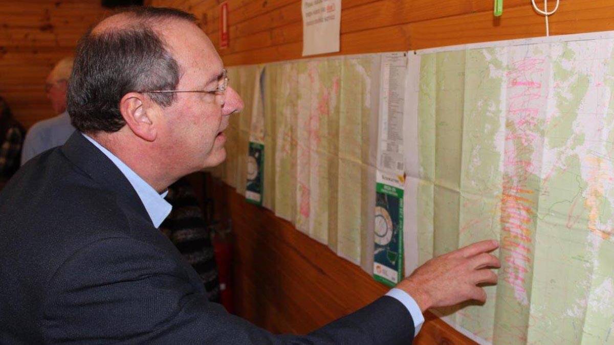 Dr Peter Hendy inspects the maps showing the extent of the black spots. 