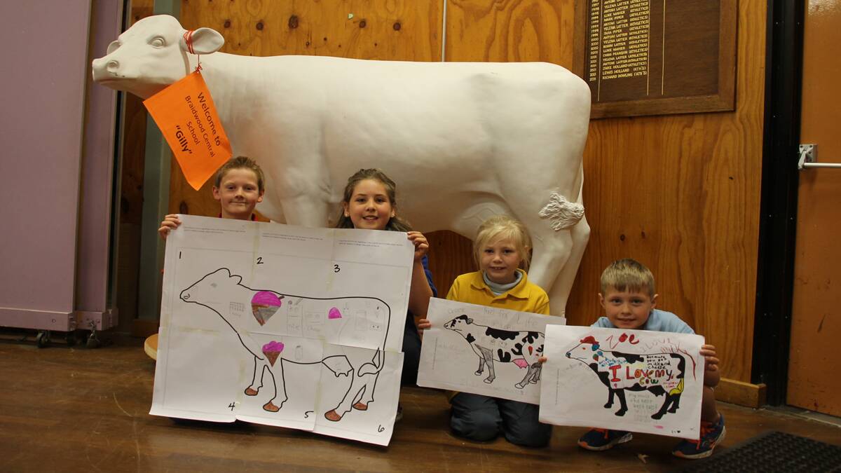 Zac, Jasmine, Anusha and Joel with Gilly the cow and some of their designs.   
