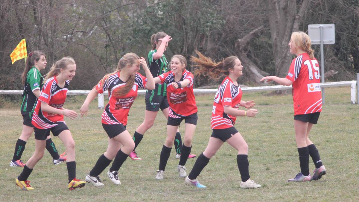 Under 15 Girls celebrate a goal