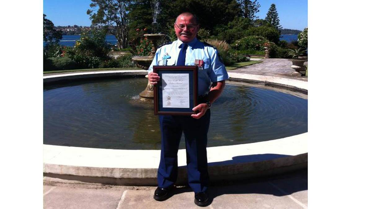 Leading Senior Constable Richard Pearce after receiving this special award from the Governor of NSW at Government House. 