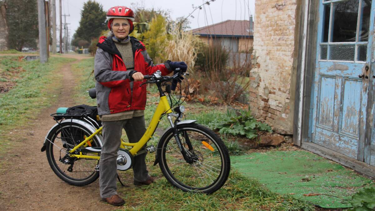 Victoria Clutterbuck with her electric powered bicycle.  