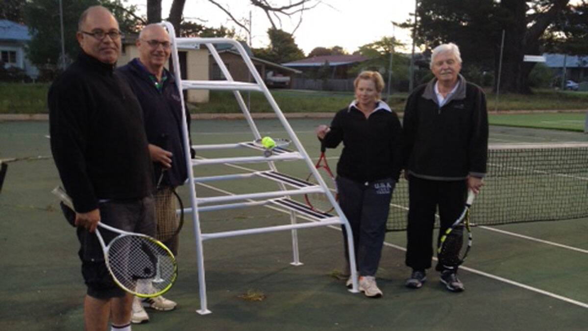 Tennis Club members Melissa Birkett, Merv Morris, Mick Toirkens and Don Hobbs with one of the newly refurbished seats.

