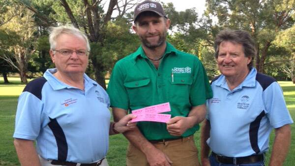 Troy Vardenega centre, accepting his prize Of winning tickets for the Wayne Grady day & dinner - Pictured with David Goddard and Mike Fitzgerald.