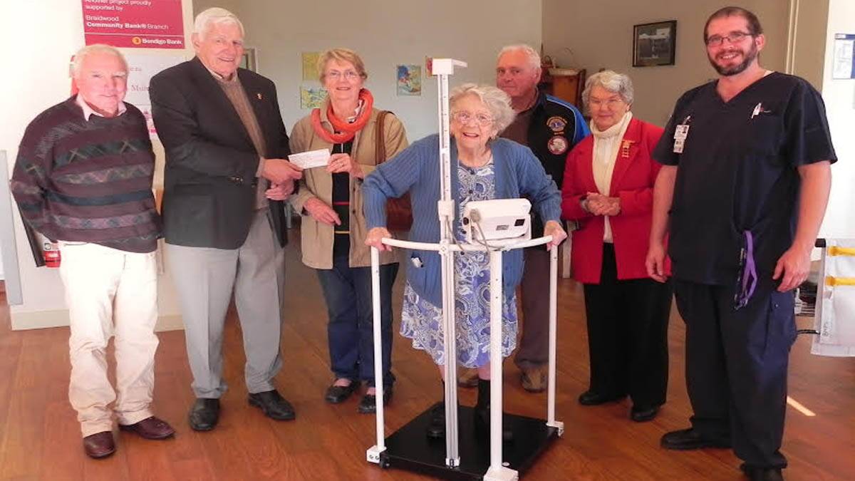 Pictured are Mrs Gloria Pitt demonstrating the machine , Nursing Manager Rob Richardson, Braidwood Hospital Auxiliary members Di Roach and Shirley Shoemark and three presentable Braidwood Lions members Jamie Raynolds, Kerry Dwyer and Gordon Stephen.   