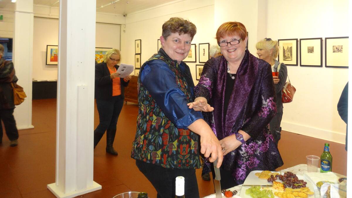 Helen and Cheryl cutting the birthday cake to celebrate 10 years of fYREGALLERY 