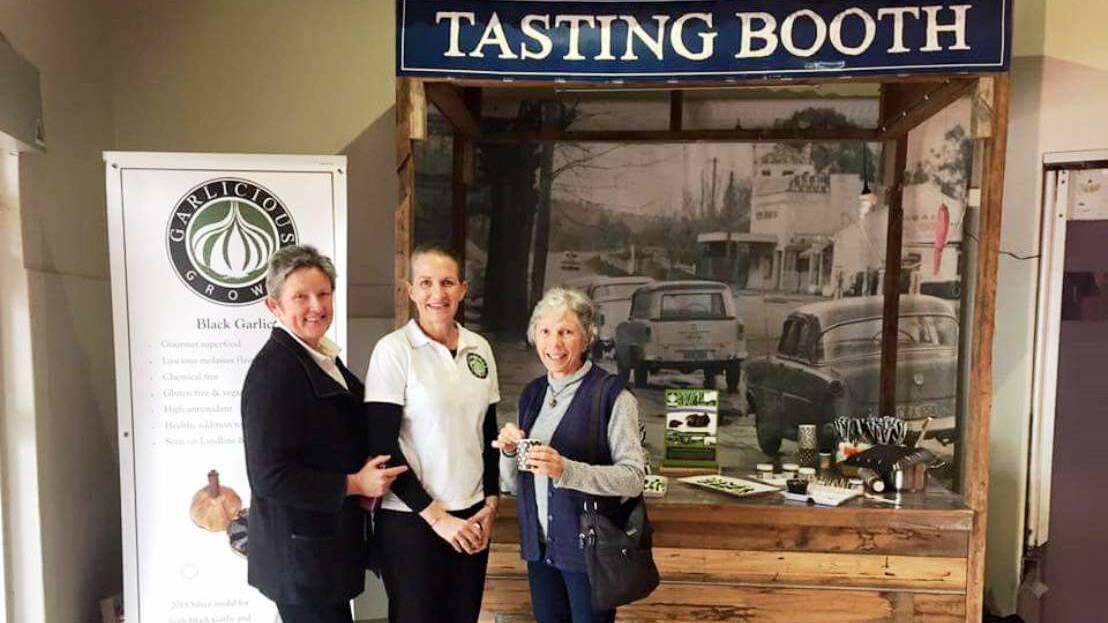 Jenny Daniher and Cathy Owen with a customer at a tasting at Wagga Wagga recently.  