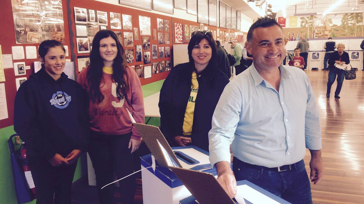 John Barilaro casts his vote on Saturday with his family in Queanbeyan. 