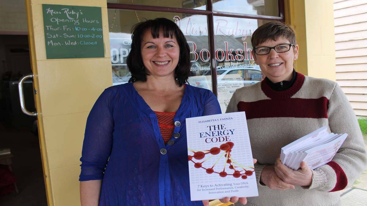 Elisabetta Faenza delivers The Energy Code to Robin Tennant-Wood at Miss Ruby’s.
