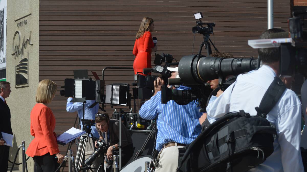 The Australian media gathers from their fixed positon outside the Playford Civic Centre, waiting for a glimpse of William and Kate during the royal visit to South Australia.