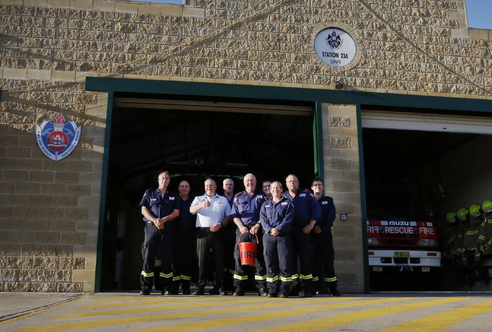 PIC OF THE WEEK: Fire & Rescue Commissioner Paul Baxter poses for a photograph with members of Braidwood Station 263, October 3. Photo: Tim Wimborne