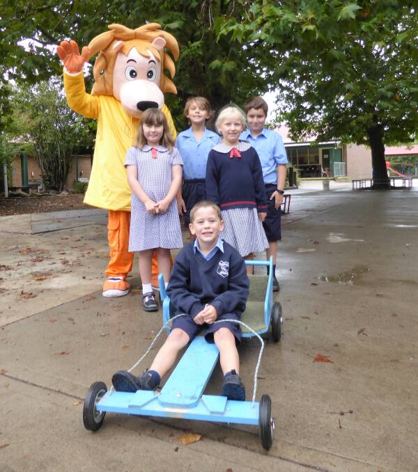 LARGE AS LIFE: Louie the Lion with St Bede's students, giving some tips about the upcoming Braidwood Community Bank Billycart Derby. Photo: supplied.