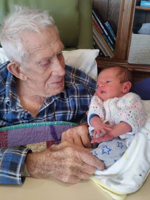 Ian Robertson, 99 and a half years, with his 16th great-grandchild, Phoebe McGrath now seven weeks. Picture: supplied.