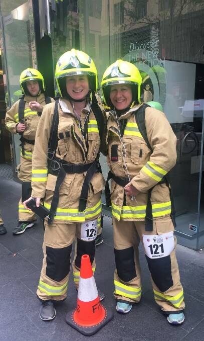 CLIMBING HIGH: Vanessa Haigh of Merimbula and Nicky Clarke of Braidwood took to the stairs to raise money for research into motor neurone disease. Photo: supplied