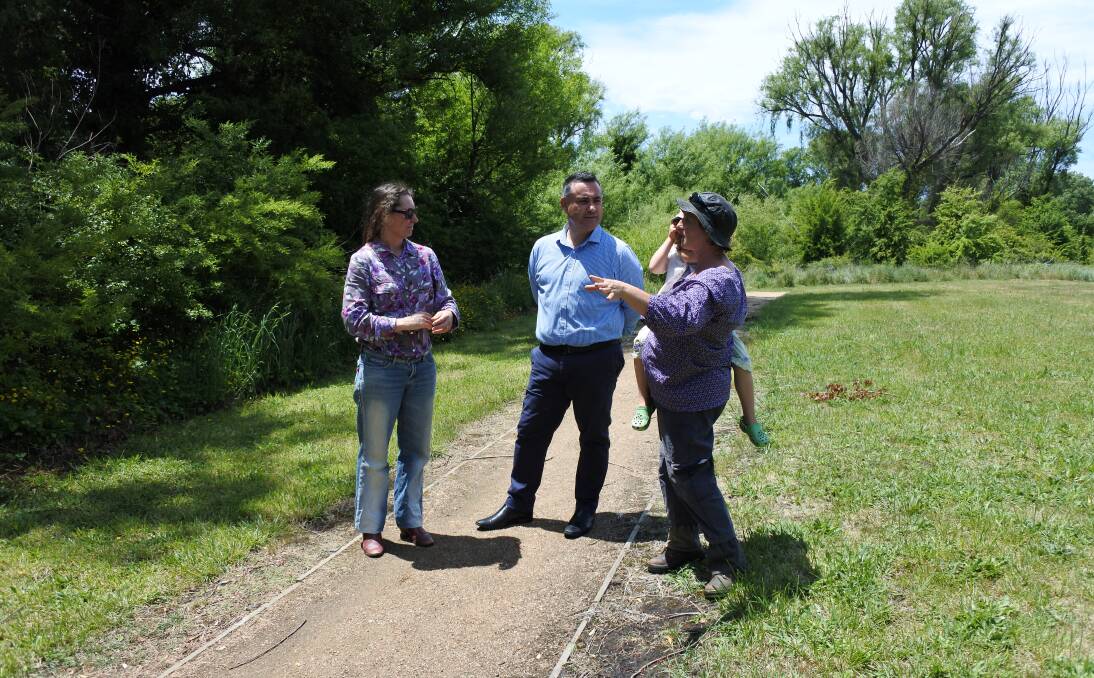 FLOOD OF IDEAS: Members of Braidwood Urban Landcare chat with Monaro MP John Barilaro about plans for the path along Flood Creek, including seats, ornamental trees and exercise equipment. Photo: Elspeth Kernebone