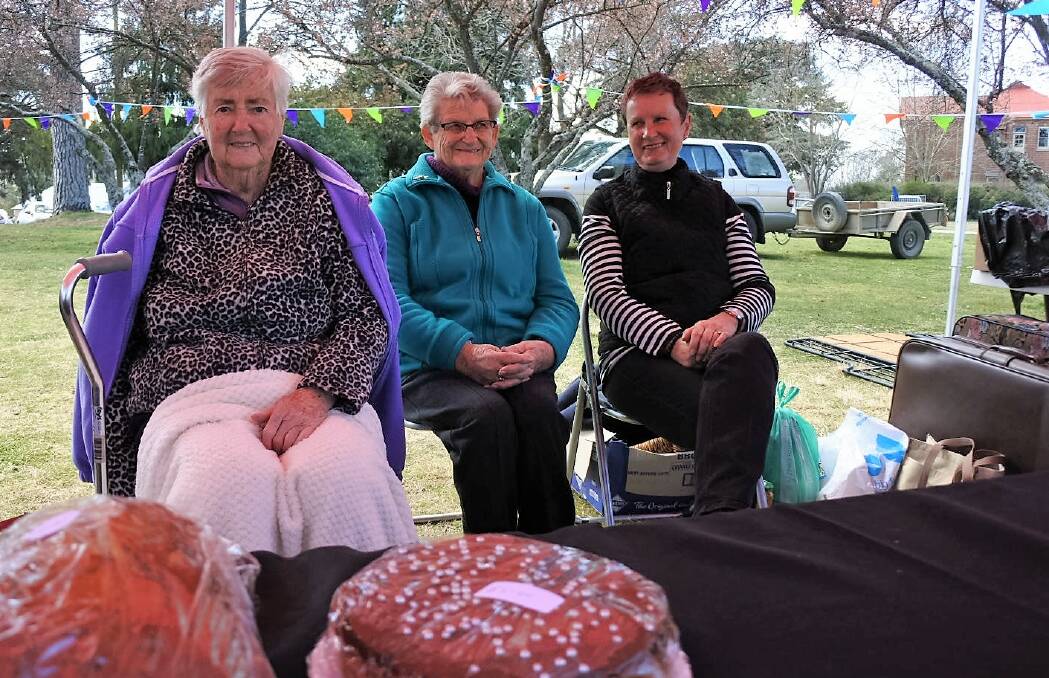 Mary Harrison, Fay Laurie and Maureen Stachow take care of the cake stall at the Daffodil Fair.