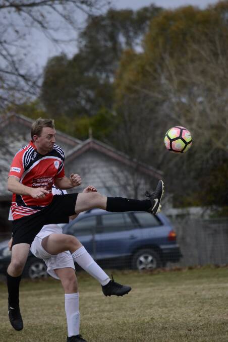 UP AND AWAY: Josh Collier in action playing for Palerang United this Saturday. Photo: Judy Knowles