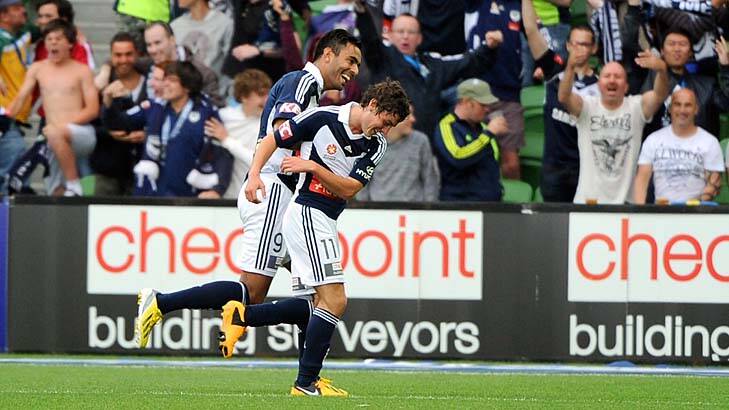 Hugs all round ... Marco Rojas is congratulated after one of his two goals in Melbourne Victory’s defeat of Sydney.