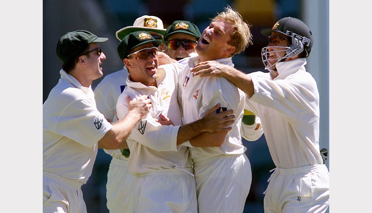 Ricky Ponting (2nd L) celebrates with team-mates Steve Waugh (L) and Justin Langer (R) after they took the wicket of Abdur Razzaq for two runs on the first ball of the fifth days play in the first test in Brisbane in November 1999. Photo: REUTERS