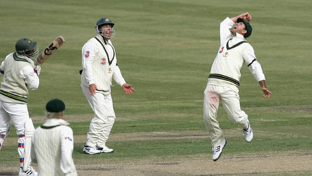 Ricky Ponting throws the ball into the air as he catches Yousuf Youhana off Shane Warne. Photo: RAY KENNEDY