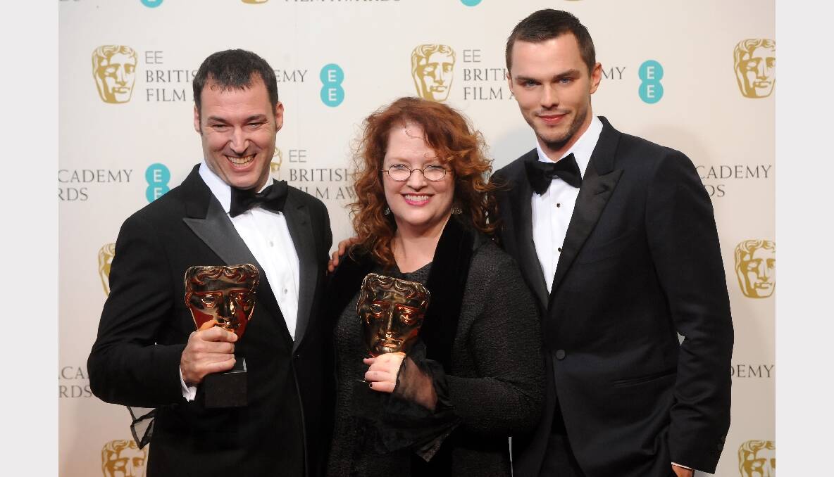 Mark Andrews (L) and Brenda Chapman (C), winners of the Animated Film film award for 'Brave', pose in the press room with presneter Nicholas Hoult (R). Photos: GETTY IMAGES, REUTERS