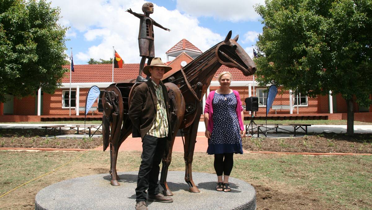 Andrew Townsend and Suzi Bleach with the installed sculpture. 
