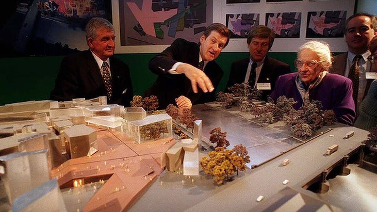 Former Victorian premier Jeff Kennett gives Dame Elisabeth an idea of what Federation Square will look like, in 1997. Photo: Jason South