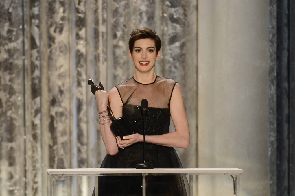 Actress Anne Hathaway accepts the award onstage for Outstanding Performance by a Female Actor in a Supporting Role for 'Les Miserables' during the 19th Annual Screen Actors Guild Awards. Photo by Mark Davis/Getty Images