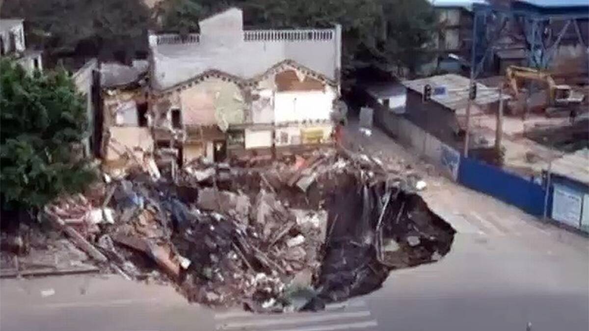 The sink hole swallows an entire building complex in Guangdong province, China. Photo: ITN screengrab