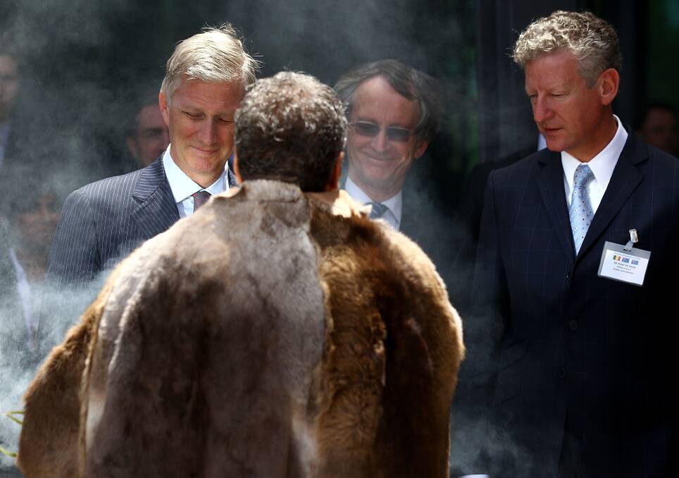 HRH Prince Philippe and the Belgium Defence Minisiter Pieter De Crem are welcomed with a smoking ceremony at Curtin University in Perth, Australia. Photo by Paul Kane/Getty Images