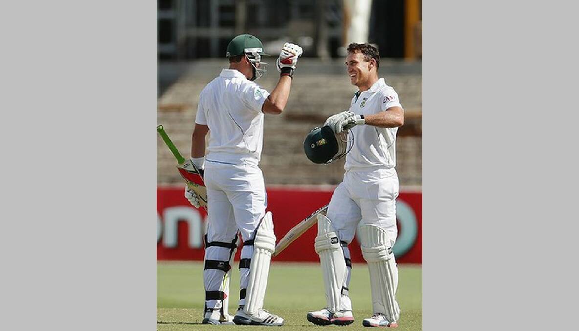 Faf du Plessis of South Africa is congratulated by Jacques Kallis of South Africa after reaching his century. Photo: Getty Images