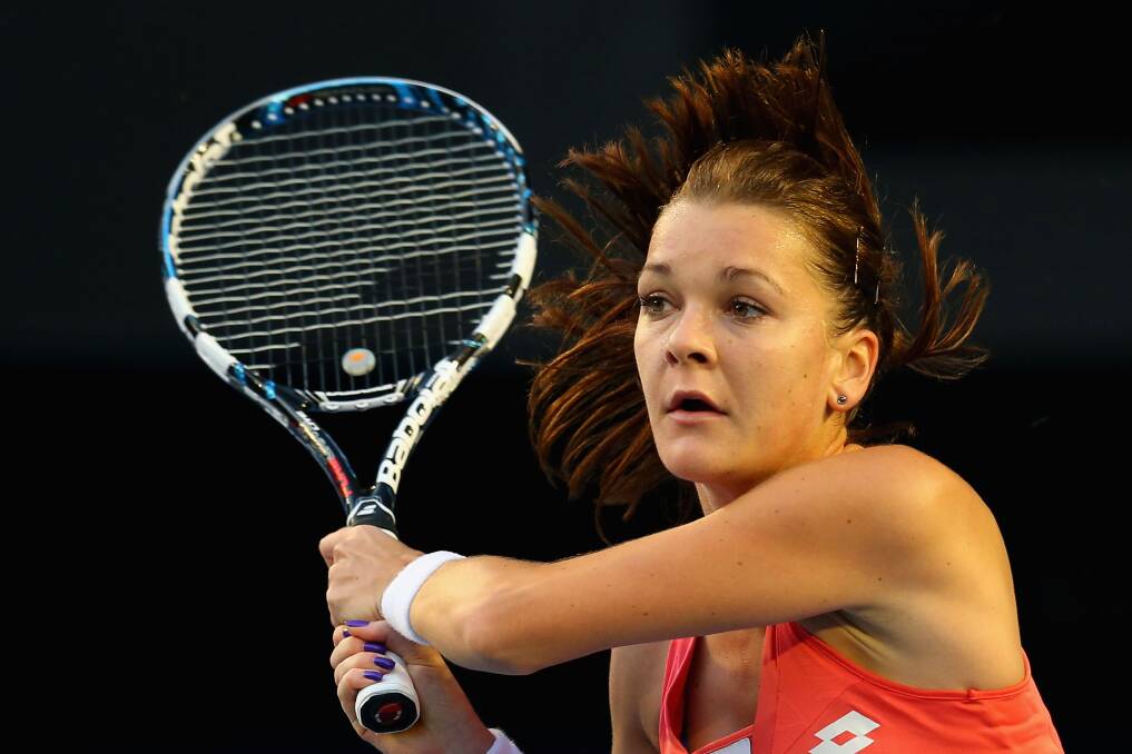Agnieszka Radwanska plays a backhand in her fourth round match against Ana Ivanovic. Photo by Julian Finney/Getty Images